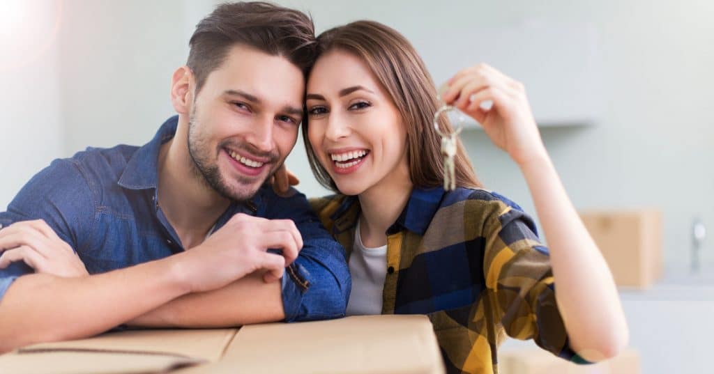 New home owners with key